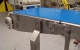 Sanitary splice plate on dimple deck slider bed conveyor frame
